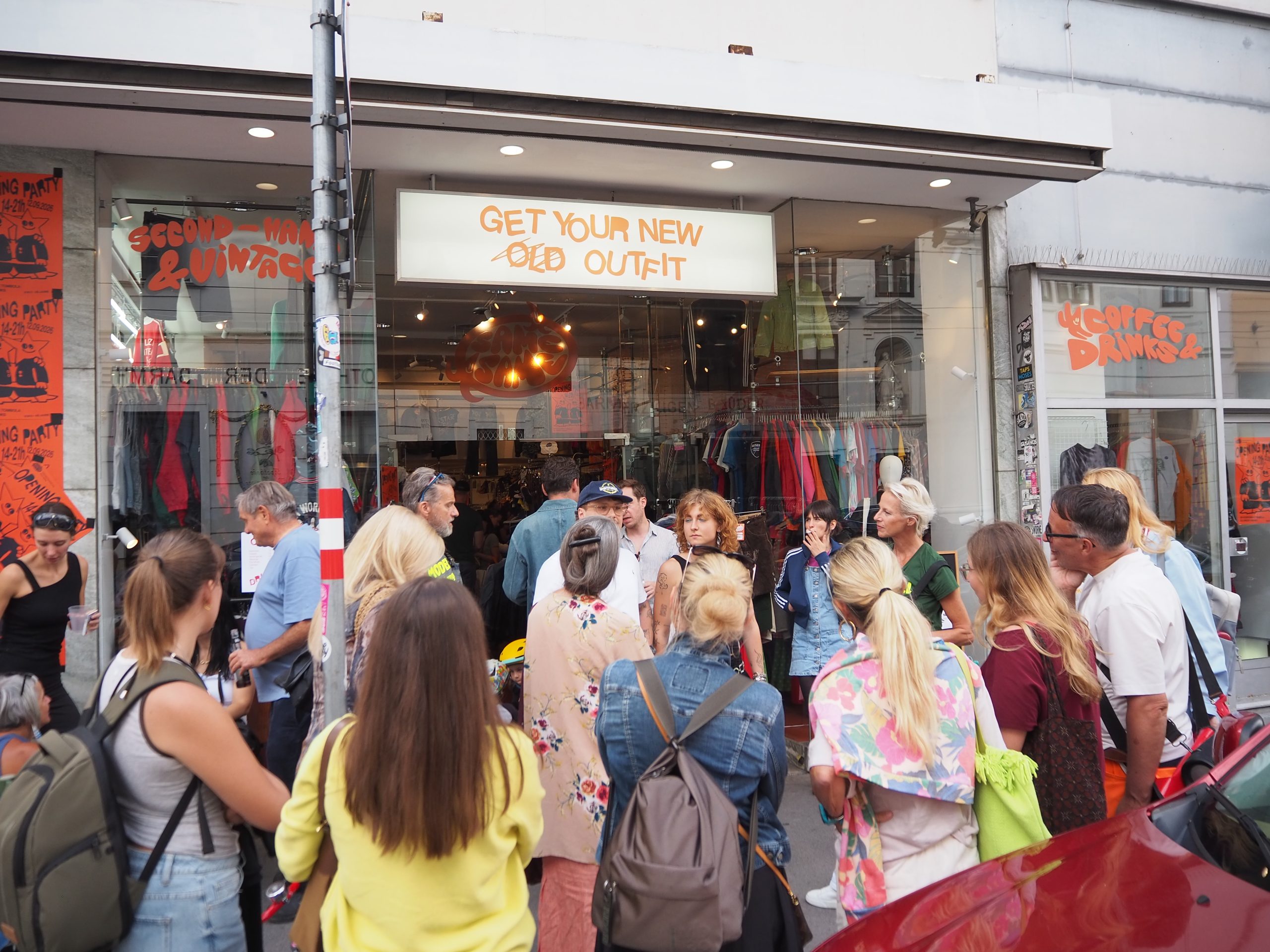 A group of Vienna Style Walk participants outside a secondhand shop